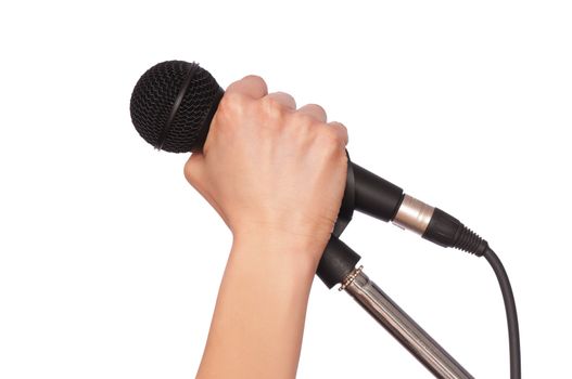 woman holding big black microphone for singing