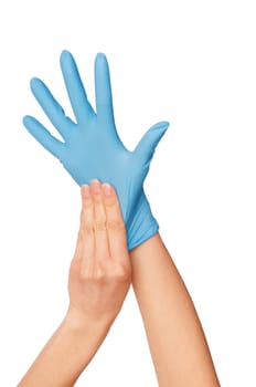 doctor putting on blue sterilized medical glove for making operation