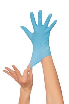 doctor putting on blue sterilized medical glove for making operation