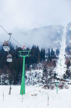 Ski lift chairs on bright winter day