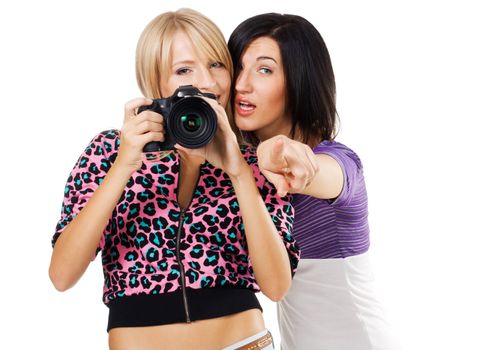 Two lovely friends with a camera, white background 