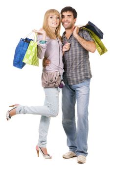 Beautiful young couple with shopping bags, isolated on white background 