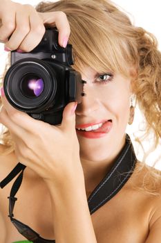 Cheerful young womanshooting with a digital photo camera