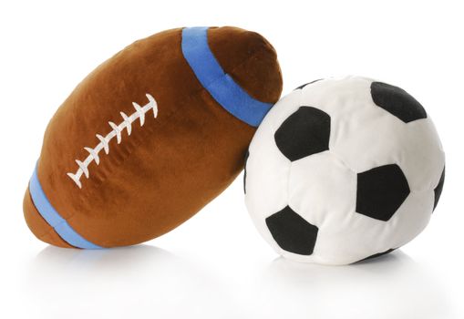 stuffed football and soccer ball with reflection on white background