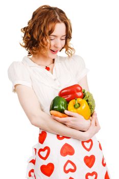 Young beautiful woman with a bunch of fresh vegatables, white background