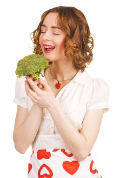 Young beautiful woman holding a broccoli, white background