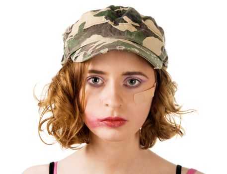 Young woman with smudged makeup an plaster on cheek, white background