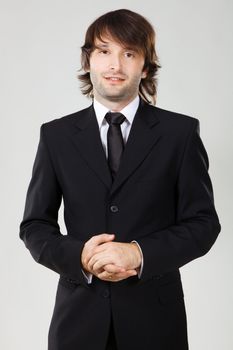 Handsome young man in business suit, studio photo