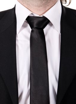 Closeup picture of a tie on a man with a suit