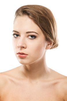 Portrait of a beautiful woman with a perfect skin, white background