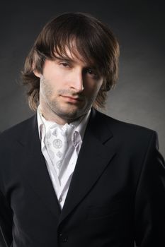 Handsome young man in business suit, studio photo