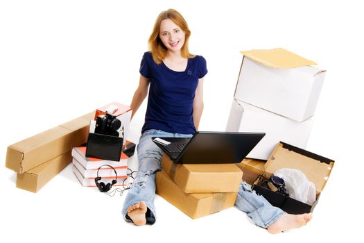 Young girl surrounded with her delivered online orders