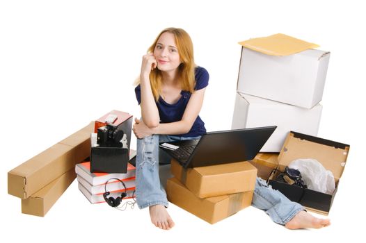 Young girl surrounded by her delivered online orders