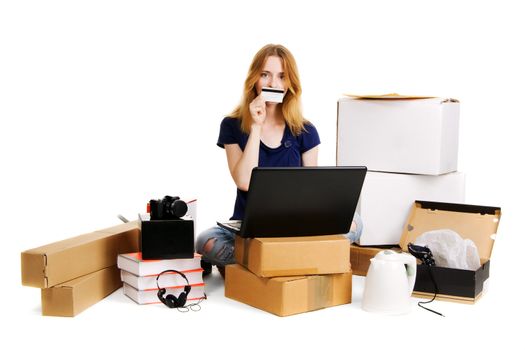 Young girl surrounded by her delivered online orders