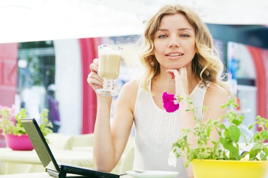 Beautiful blond lady in a restaurant