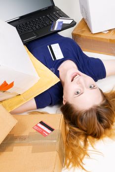 Young girl surrounded with her delivered online orders