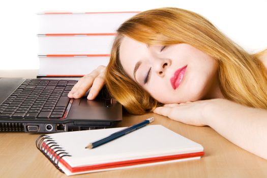 Young woman sleeping at her workplace