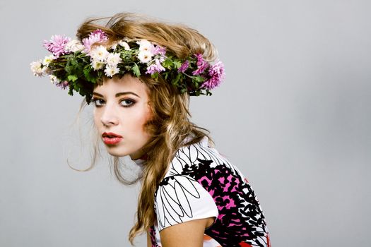 Portrait of a beautiful fashion model in flower crown