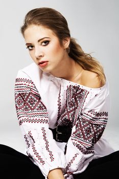 Portrait of a young beautiful woman in national Slavic clothing