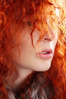 Closeup portrait of a beautiful red-haired woman