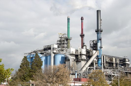 oil refinery skyline  in europoort Netherlands with nature on foreground