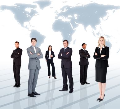 Businesspeople standing against a world map