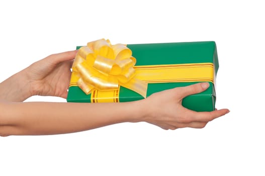 woman giving a green box with yellow ribbon as a gift