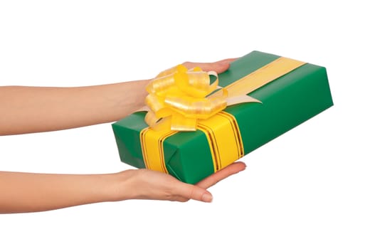 woman giving a green box with yellow ribbon as a gift