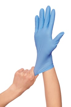 Doctor putting on blue sterilized medical glove for making operation