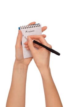 business woman writes missions for business plan