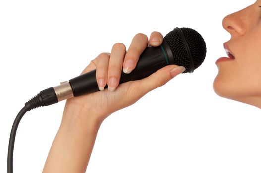 The singer sings a song in a microphone