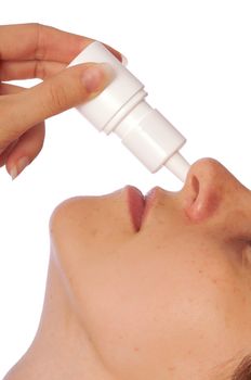 The woman drips drops for a nose for fast recover