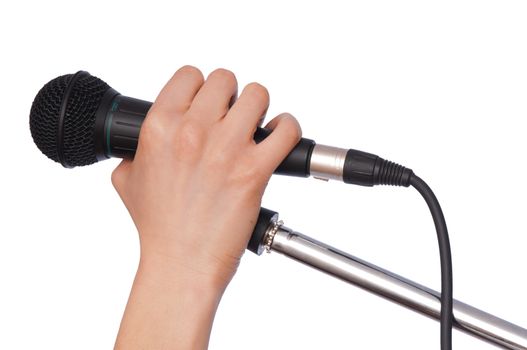 woman holding big black microphone for singing