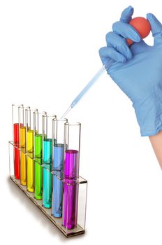 chemist in blue gloves making test in a laboratory with samples