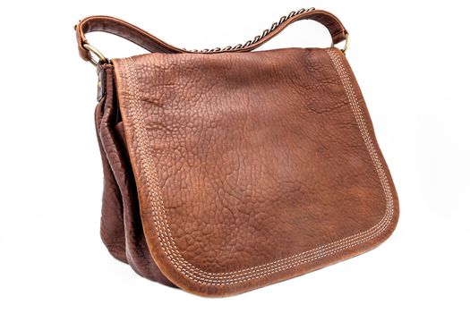 A leathern handbag on a white background
