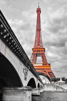 Eiffel tower monochrome view with river and bridge, selective colorisation, Paris, France