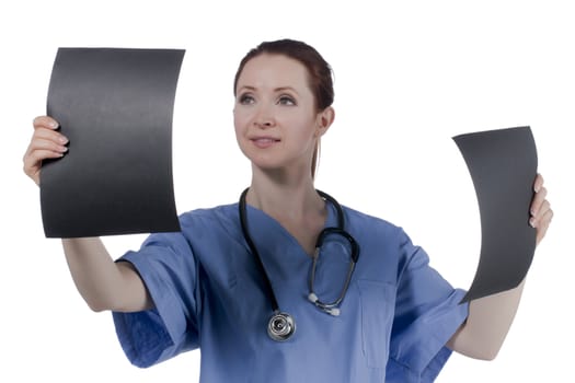 Female doctor carefully looking at x-ray films