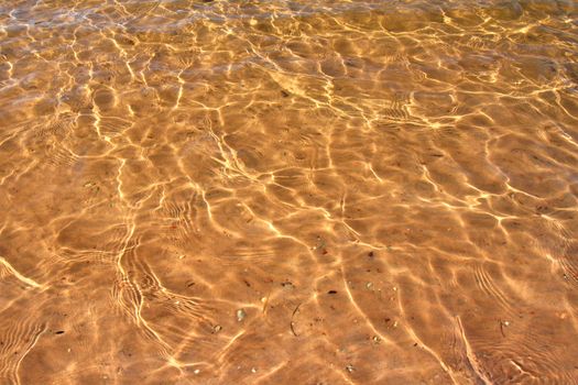 Interesting patterns in the sand seen through crystal clear Wisconsin waters.