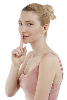 Close-up image of a pretty woman with a silent gesture isolated on a white surface