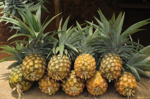 Pile of pineapples at a local market, Thailand.