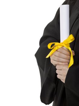 Graduate holding a diploma with yellow ribbon