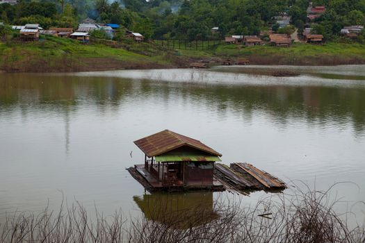 building houseboat on the lake in Thailand