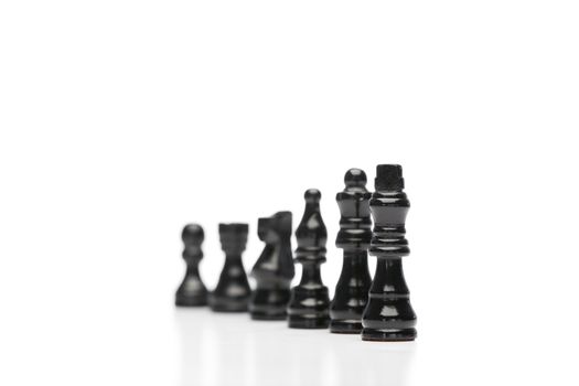 Black pieces of chess on a white background