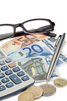 Money, pen, glasses and pocket calculator on a white background