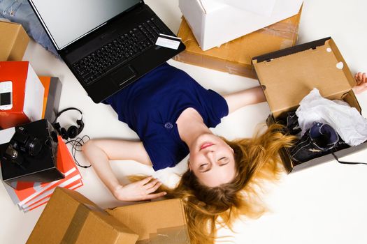 Young girl surrounded with her delivered online orders
