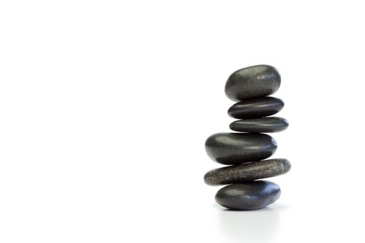 Piled up pebbles on a white background