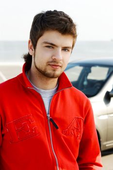 Hansdsome young man in red jacket