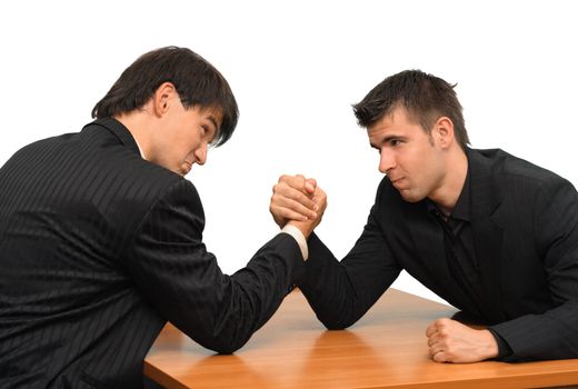 Two businessmen competing in arm wrestling