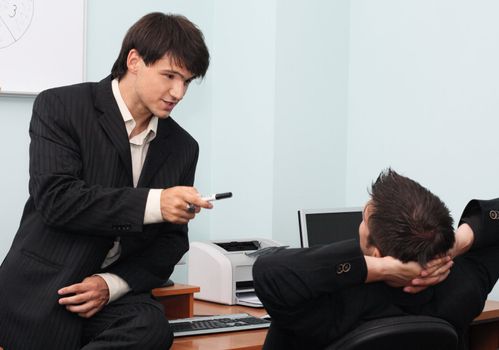 Two young businessmen having an informal discussion