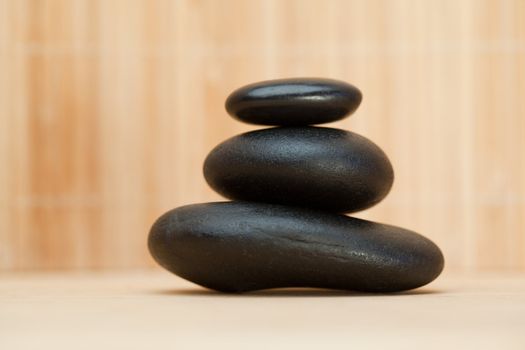 Piled up pebbles on a brown background
